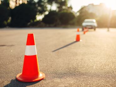 Cones for the examination, driving school concept. lesson for novice car drivers, test for beginner