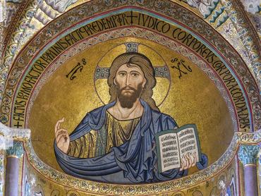 Close-up of Cefalu Cathedral with prominent Christ Pantocrator mosaic in the apse in Cefalu, Sicily, Italy, a UNESCO heritage site