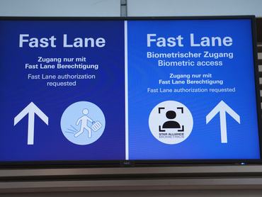28 April 2022, Hamburg: Signs reading "Fast Lane" point the way to biometric facial recognition at the security checkpoint in the departure area of Hamburg Airport. The new service is available to Star Alliance (Austrian, Swiss and Lufthansa) passengers participating in the Miles & More loyalty program. Passengers will receive contactless access to the security checkpoint and boarding. A boarding pass or smartphone no longer need to be presented. Photo: Marcus Brandt/dpa (Photo by Marcus Brandt/picture alliance via Getty Images)