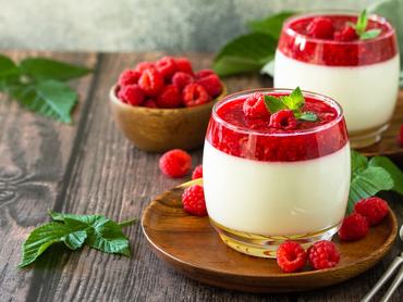 Raspberry Panna cotta with raspberry jelly, Italian dessert, homemade cuisine. Copy space.