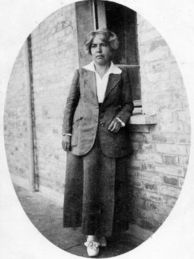 Grazia Deledda, Italian writer and translator, leaning against a window sill (Photo by Mondadori via Getty Images)