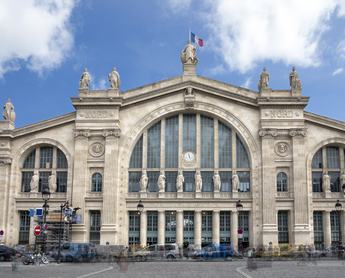 "The facade of the railway station Gard du Nord in Paris, France. Multiple exposure."