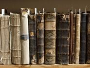 400 year old antique books in a library. Photo was taken at avaible light, for accurate representation of the atmosphere inside.