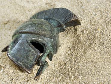 Greec helmet in sand