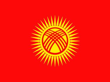 The flag of Kyrgyzstan features a red field with a yellow sun centered near the hoist side. In the center of the sun is a depiction of a stylized yurt, a traditional dwelling of the Kyrgyz people. Surrounding the sun are 40 rays representing the 40 tribes of Kyrgyzstan. The red color symbolizes valor and bravery, while the sun represents peace and prosperity. Overall, the flag embodies the cultural heritage, unity, and aspirations of the Kyrgyz people.