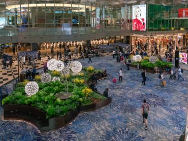 This is the departure area with shops and restaurants in Changi Airport, a famous airport on May 11, 2023 in Singapore,