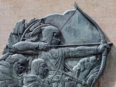Nottingham, UK - June 28th 2025: Plaque depicting Robin Hood fighting Guy of Gisborne's Men - located near the Robin Hood statue outside Nottingham Castle in Nottingham, UK.
