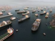 Cargo vessels congestion blocking maritime traffic in the Strait of Hormuz, tankers and container cargo ships clustered in aerial 3D illustration render. Strategic maritime chokepoint linking the Persian Gulf and Gulf of Oman. Global trade dependency, export logistics, freight transport, supply chain vulnerability, geopolitical tension 3D