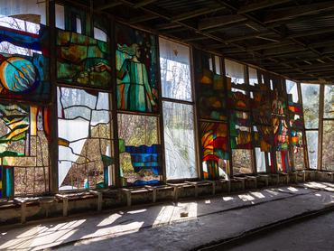 Stained-glass windows are seen at the Prypiat cafe in Prypiat, a city abandoned after the Chornobyl accident, Kyiv region, Ukraine, on April 14, 2026. April 26, 2026, marks the 40th anniversary of the explosion of the fourth reactor at the Chornobyl Nuclear Power Plant, which occurred on April 26, 1986. The accident remains one of the most significant incidents in the history of nuclear energy. (Photo by Kyrylo Chubotin/Ukrinform/NurPhoto via Getty Images)