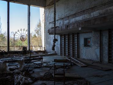The Ferris wheel is seen through the windows of a gym in the Palace of Culture Energetik in Pripyat, a city abandoned after the Chornobyl accident, in the Kyiv region, Ukraine, on April 14, 2026. April 26, 2026, marks the 40th anniversary of the explosion of the fourth reactor at the Chornobyl Nuclear Power Plant, which occurred on April 26, 1986. The accident remains one of the most significant incidents in the history of nuclear energy. (Photo by Kyrylo Chubotin/Ukrinform/NurPhoto via Getty Images)