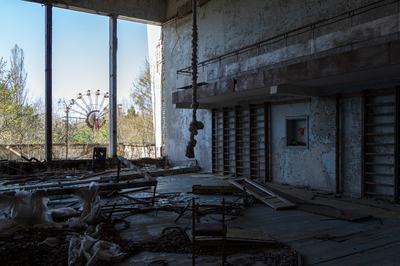 The Ferris wheel is seen through the windows of a gym in the Palace of Culture Energetik in Pripyat, a city abandoned after the Chornobyl accident, in the Kyiv region, Ukraine, on April 14, 2026. April 26, 2026, marks the 40th anniversary of the explosion of the fourth reactor at the Chornobyl Nuclear Power Plant, which occurred on April 26, 1986. The accident remains one of the most significant incidents in the history of nuclear energy. (Photo by Kyrylo Chubotin/Ukrinform/NurPhoto via Getty Images)
