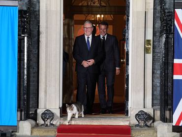 President of France Emmanuel Macron, and Prime Minister Sir Keir Starmer, laugh at Larry the Cat as they walk out for a photo at the door of number 10 Downing Street, Westminster, after talks about ongoing support and solidarity for Ukraine. Picture date: Sunday June 7, 2026. (Photo by Lucy North/PA Images via Getty Images)