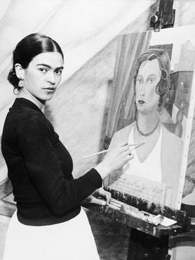 (Original Caption) 1/22/1931- Even though her famous husband sits by and declines to comment on her art ambitions, Mrs. Diego Rivera, wife of the famous Mexican artist, can and does, do very passable portraits. Photo shows Mrs. Diego Rivera painting one now, and she is doing a mural for the San Francisco Stock Exchange, with one of her portraits of a San Francisco society woman.
