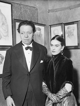 Artists Diego Rivera and Frida Kahlo visit an art gallery exhibition of Jewish portraits by Lionel Reiss in New York.