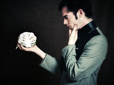 Modern men with cauliflower. "To be or not to be... vegeterian"