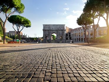 Arc of Constantin and Colosseum in Rome at sunrise, Italy